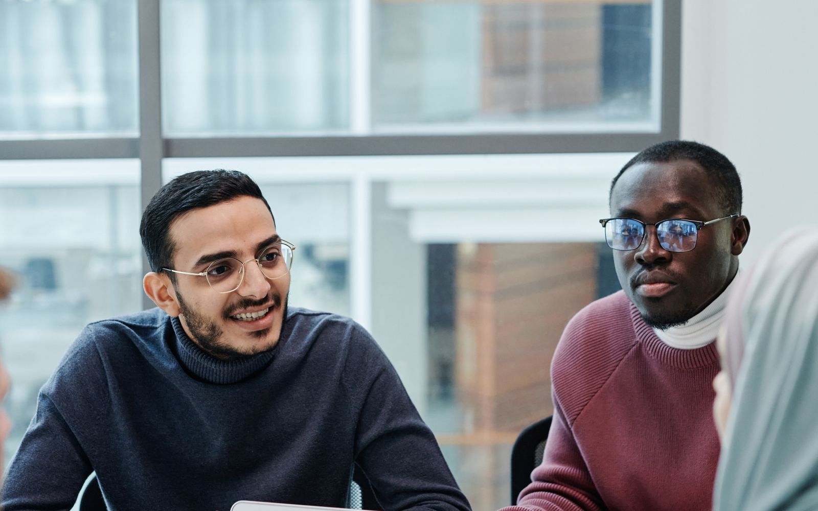 A diverse team discussing business analytics in a modern office