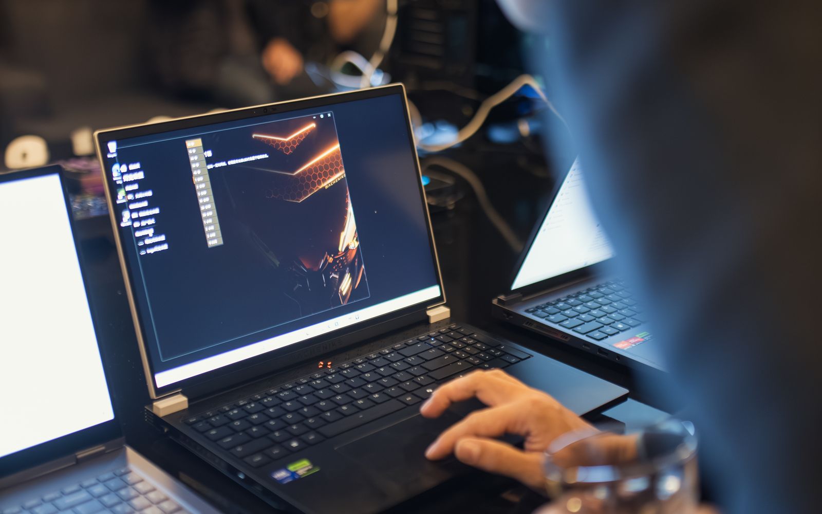 An IT professional working on a laptop assessment