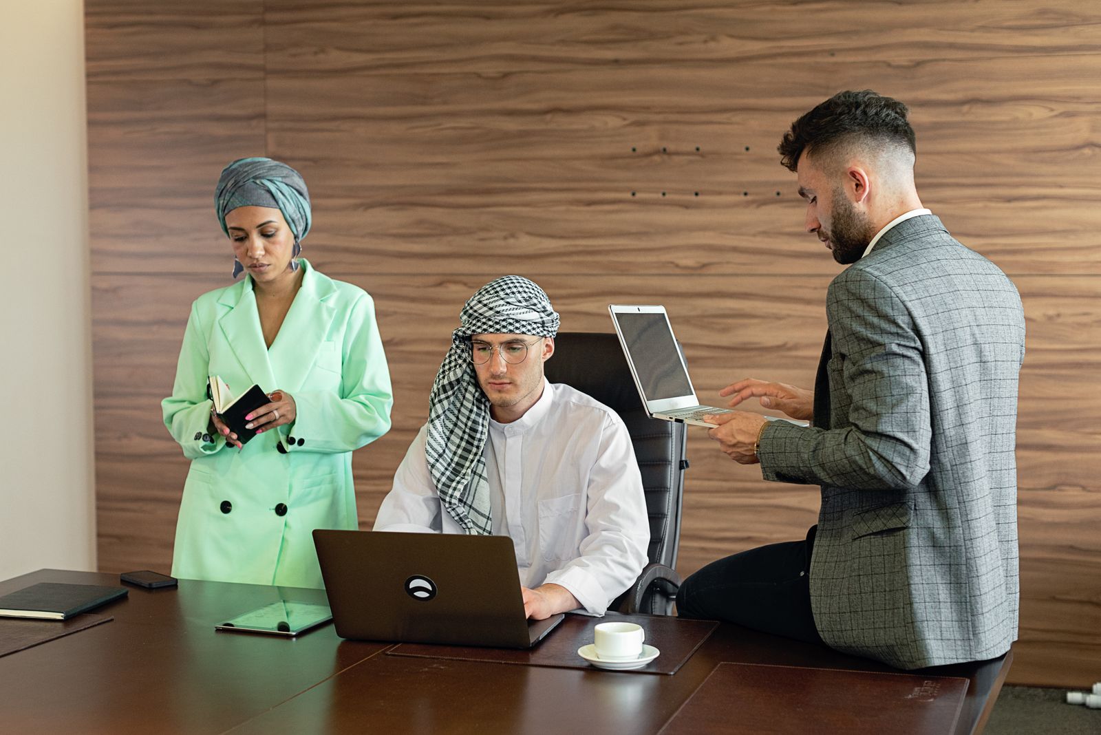 Middle Eastern business professionals collaborating in an office